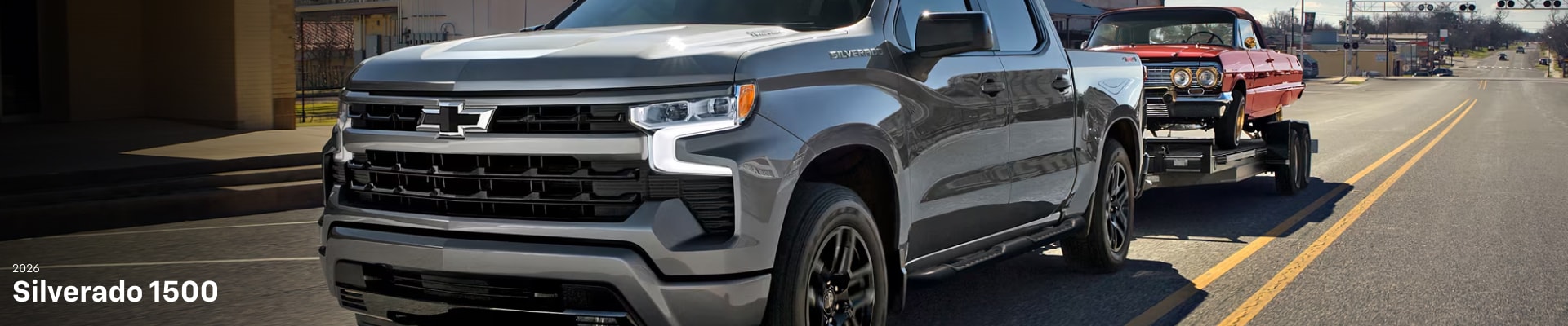 2026 Chevrolet Silverado 1500 RST towing a classic Chevy Impala