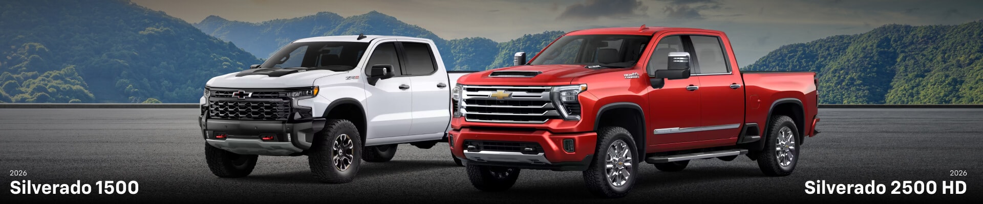 2026 Chevy Silverado 2500 HD in Radiant Red in front and a 2026 Silverado 1500 Crew Cab in Summit White in back