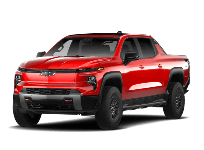 Front three-quarter view of a 2026 Chevy Silverado EV Trail Boss in Habanero Orange.
