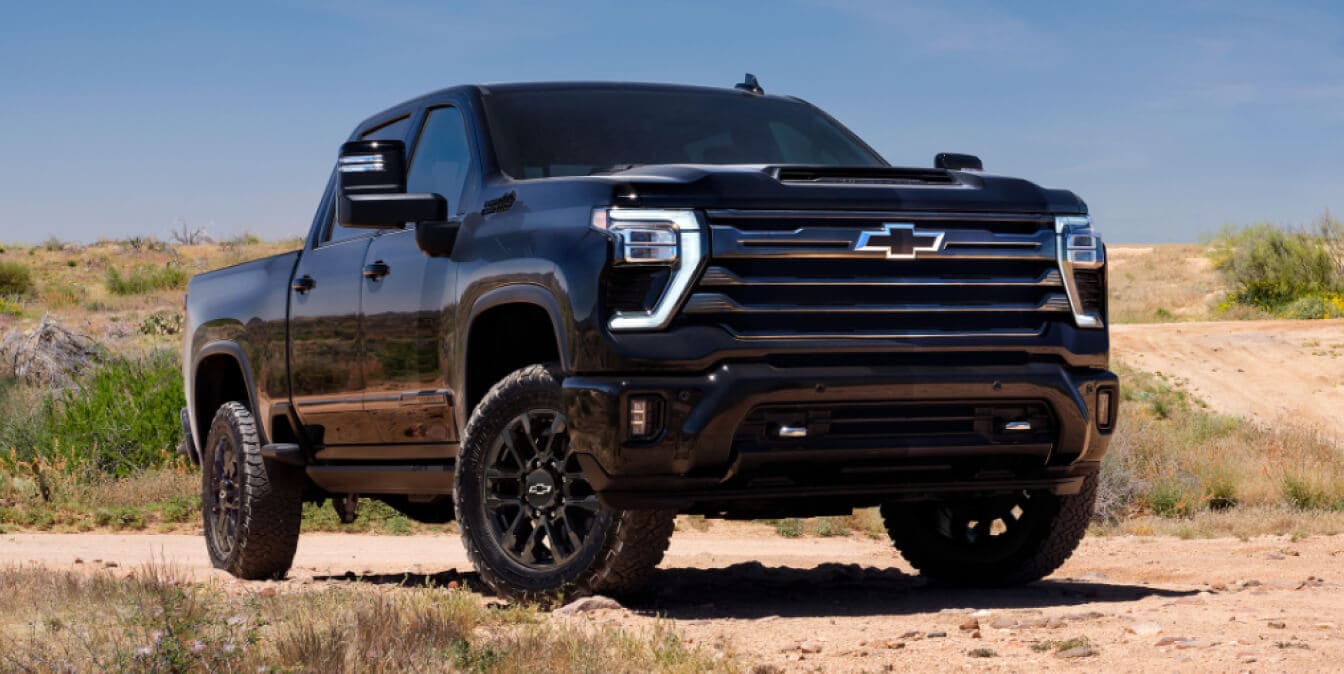 2025 Chevrolet Silverado 2500 Crew Cab HD High Country in Black with SRI wheels parked in the desert