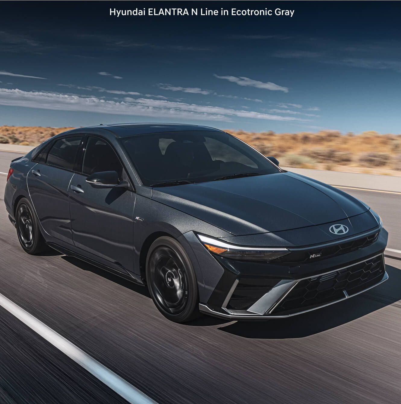 2026 Hyundai Elantra N Line driving on a highway through the desert