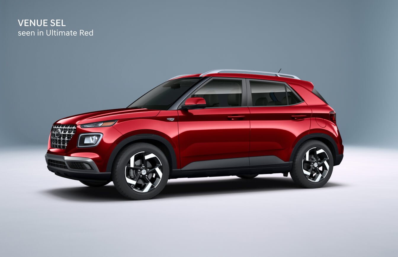 2026 Hyundai Venue SEL in Ultimate Red, front three-quarter studio view.