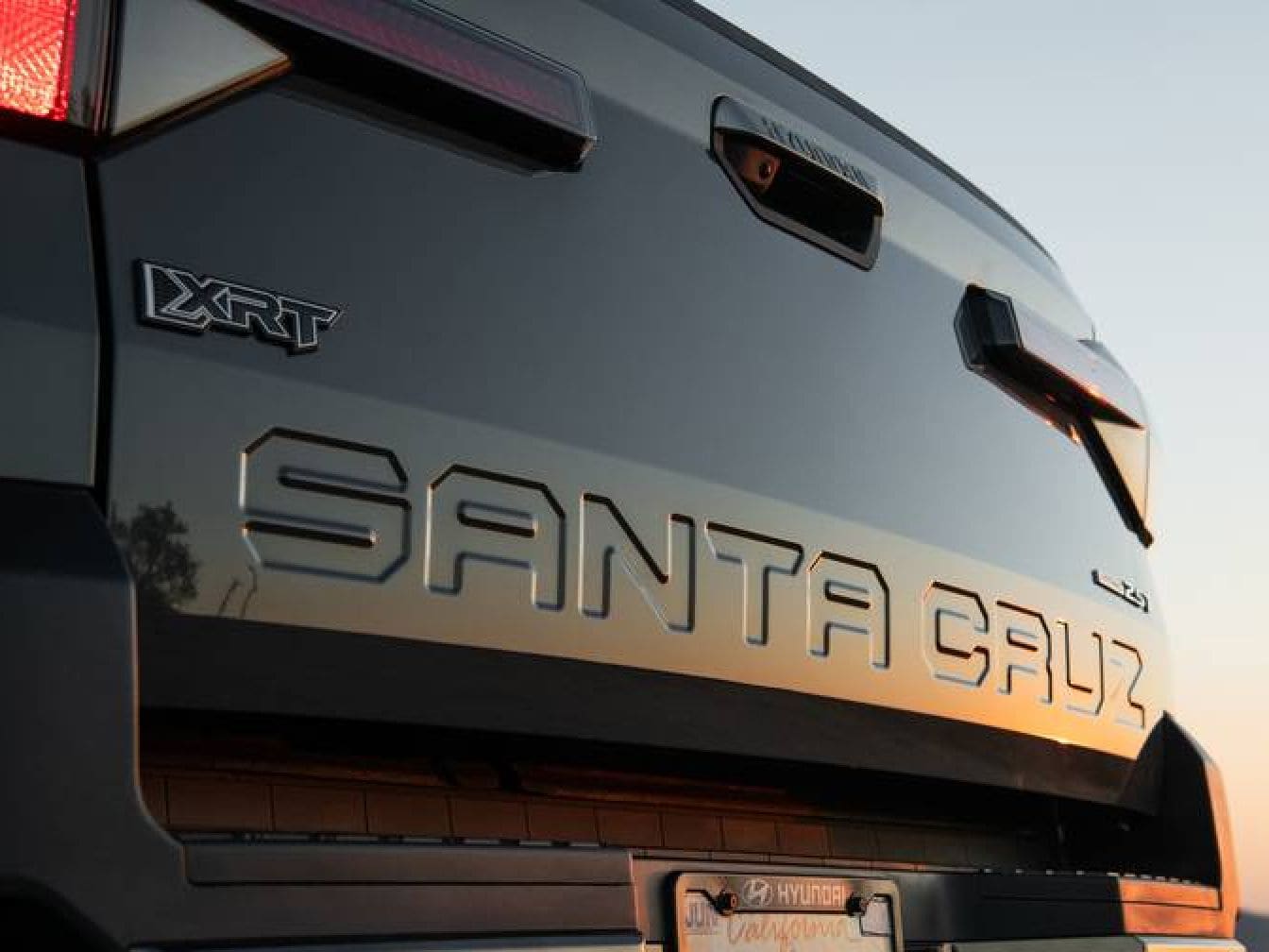 Close-up of the Hyundai Santa Cruz tailgate featuring embossed lettering and XRT badging.