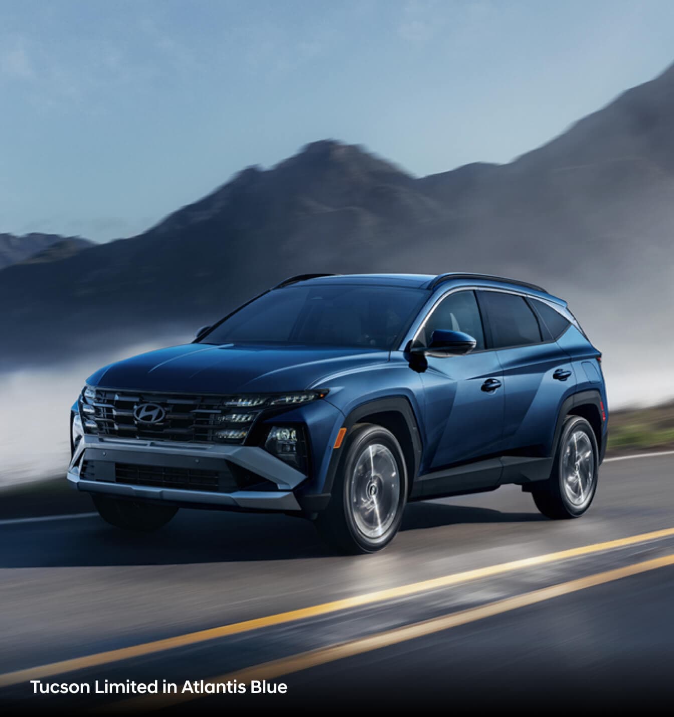 2026 Hyundai Tucson XRT in red parked on a dirt terrain and a close-up image of the front right tire and rim