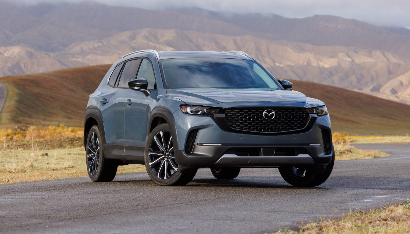 New Mazda CX-50 in Polymetal Gray Metallic parked in front of a desert landscape