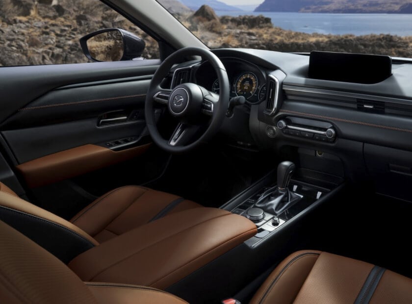 Interior front seat shot of a 2025 Mazda CX-50 featuring Terracotta Leather Interior