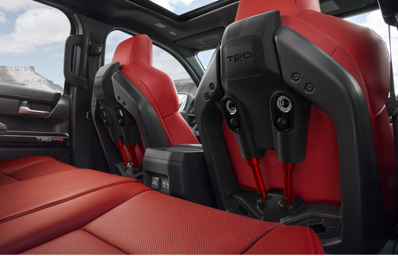 Interior view of a Toyota Tacoma TRD Pro showcasing Cockpit Red SofTex® front seats.