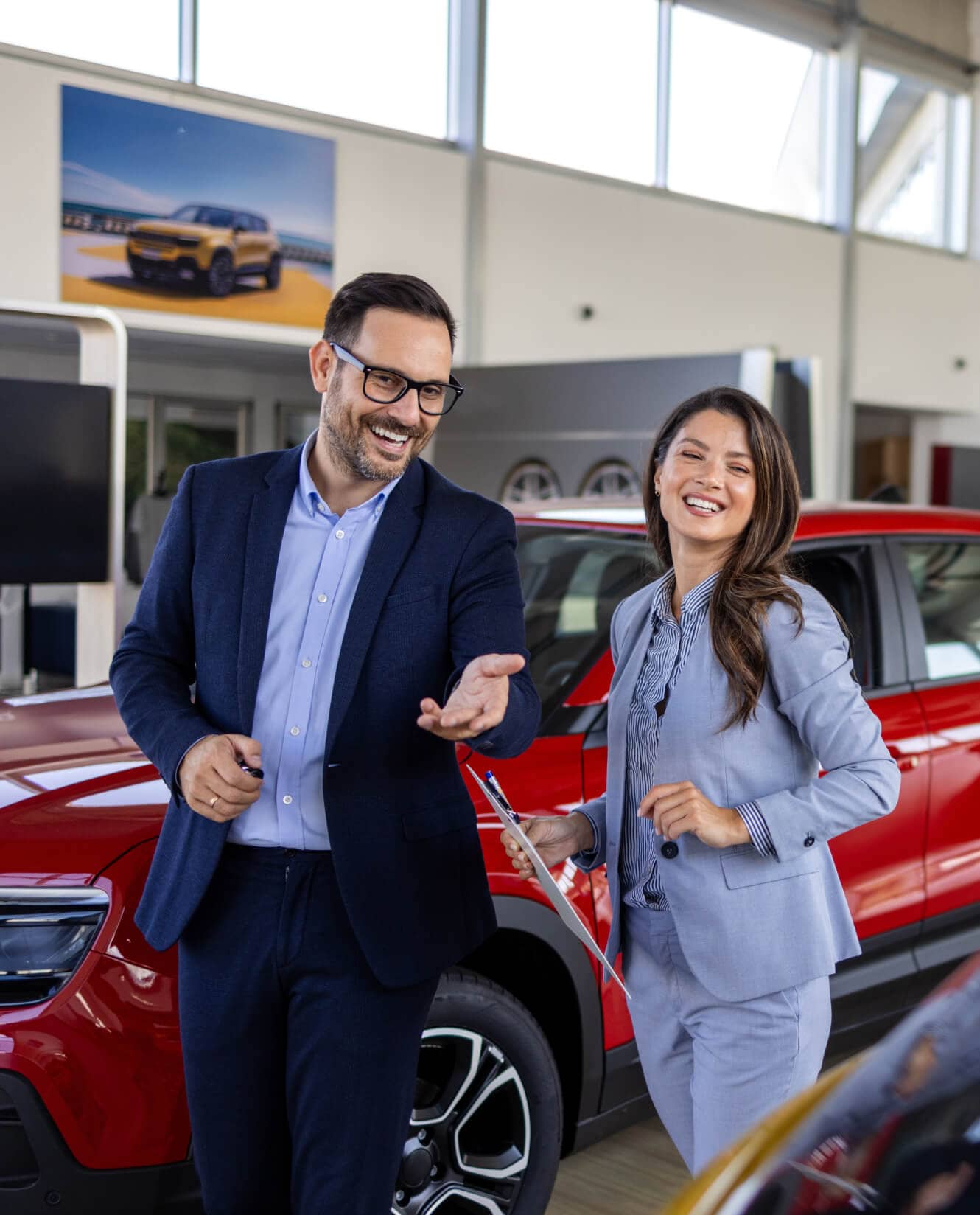 McGee Car Sales Team looking over new cars inside a dealership