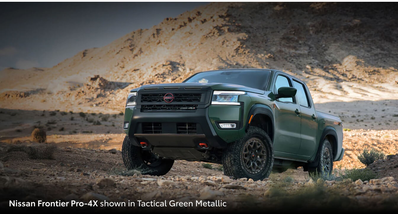 2026 Toyota Tacoma parked in front of mountainous terrain