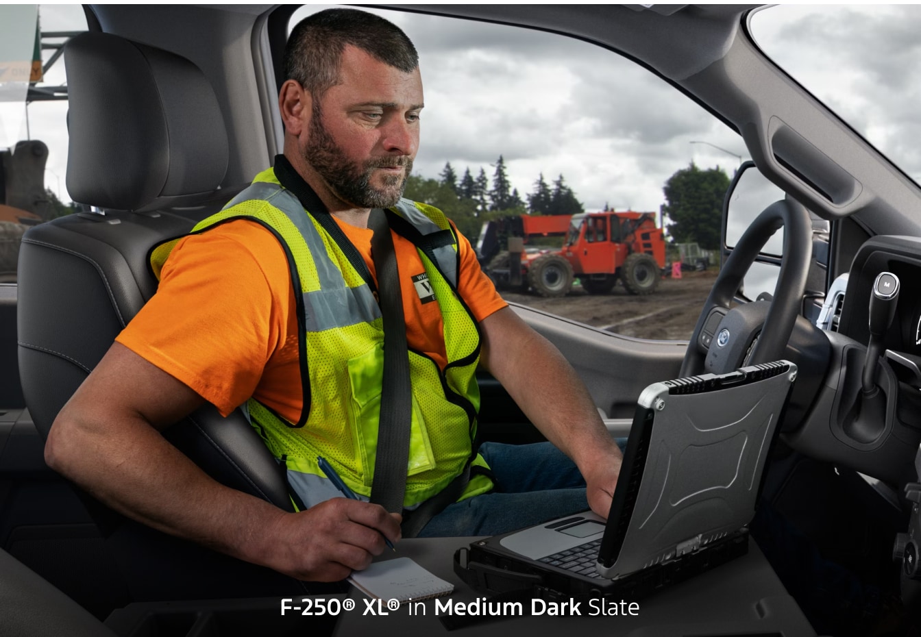 Construction worker inside of a 2026 Ford F-250 XL