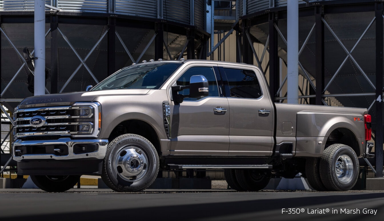 Ford Super Duty F-350 Lariat in Marsh Gray parked on a job site