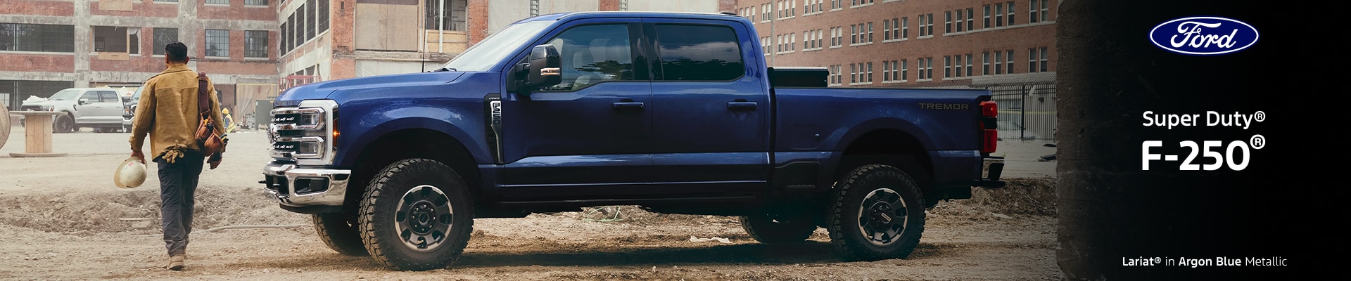 2026 Ford F-250 Lariat in Argon Blue parked on a construction site