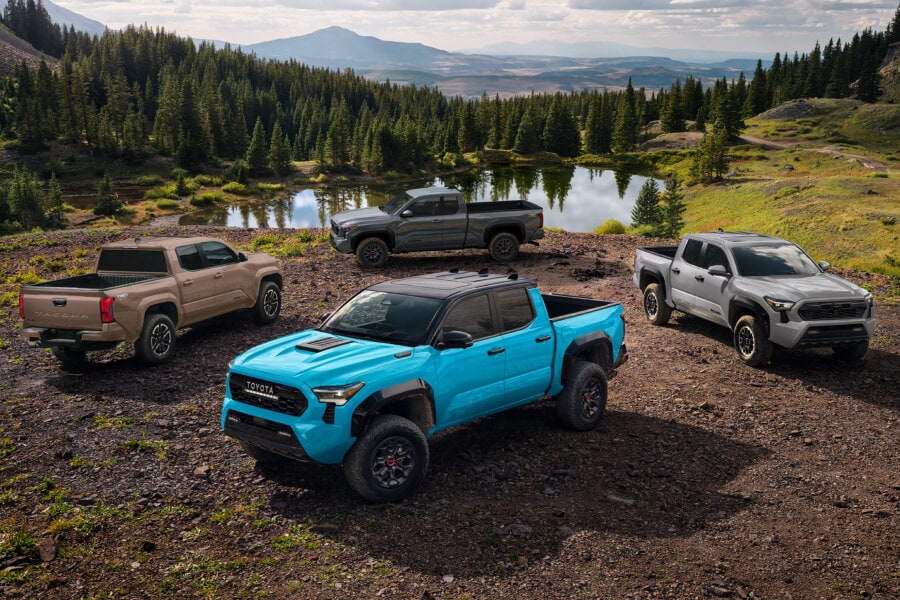 2025 Toyota Tacoma Hybrid Trailhunter in Bronze Oxide parked over wet and muddy terrain
