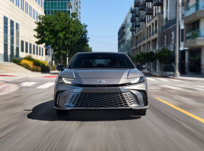2025 Toyota Camry XSE in Heavy Metal driving downtown