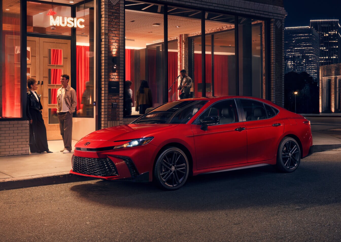 2026 Toyota Camry Hybrid Nightshade in Supersonic Red