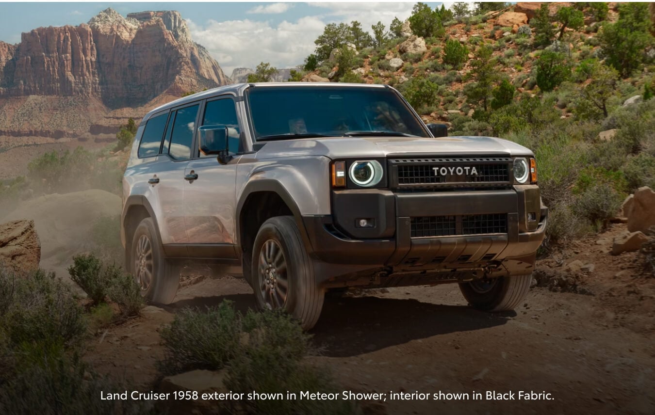 Three-quarter view of a Toyota Land Cruiser 1958 in Meteor Shower on a rocky off-road trail.
