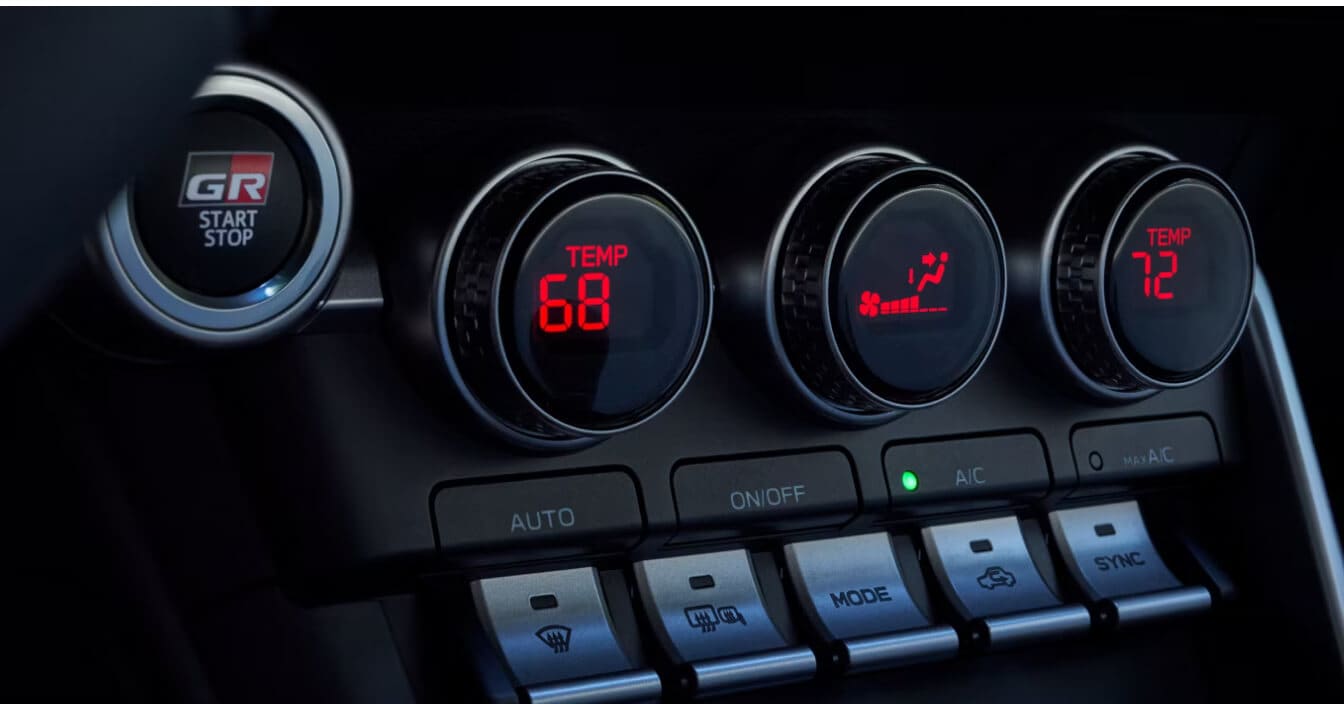 A close-up shot of the Toyota GR86 dual-zone automatic climate controls.