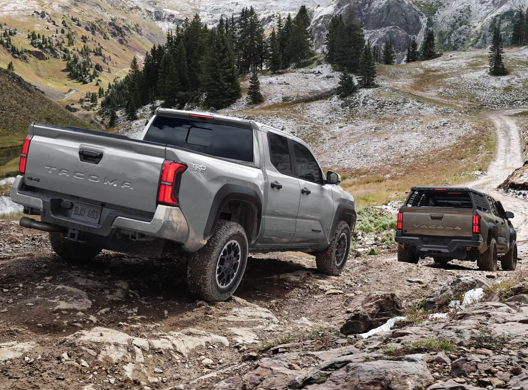 Toyota Tacoma TRD Off-Road in Celestial Silver Metallic driving downhill in the mountains of New Hampshire
