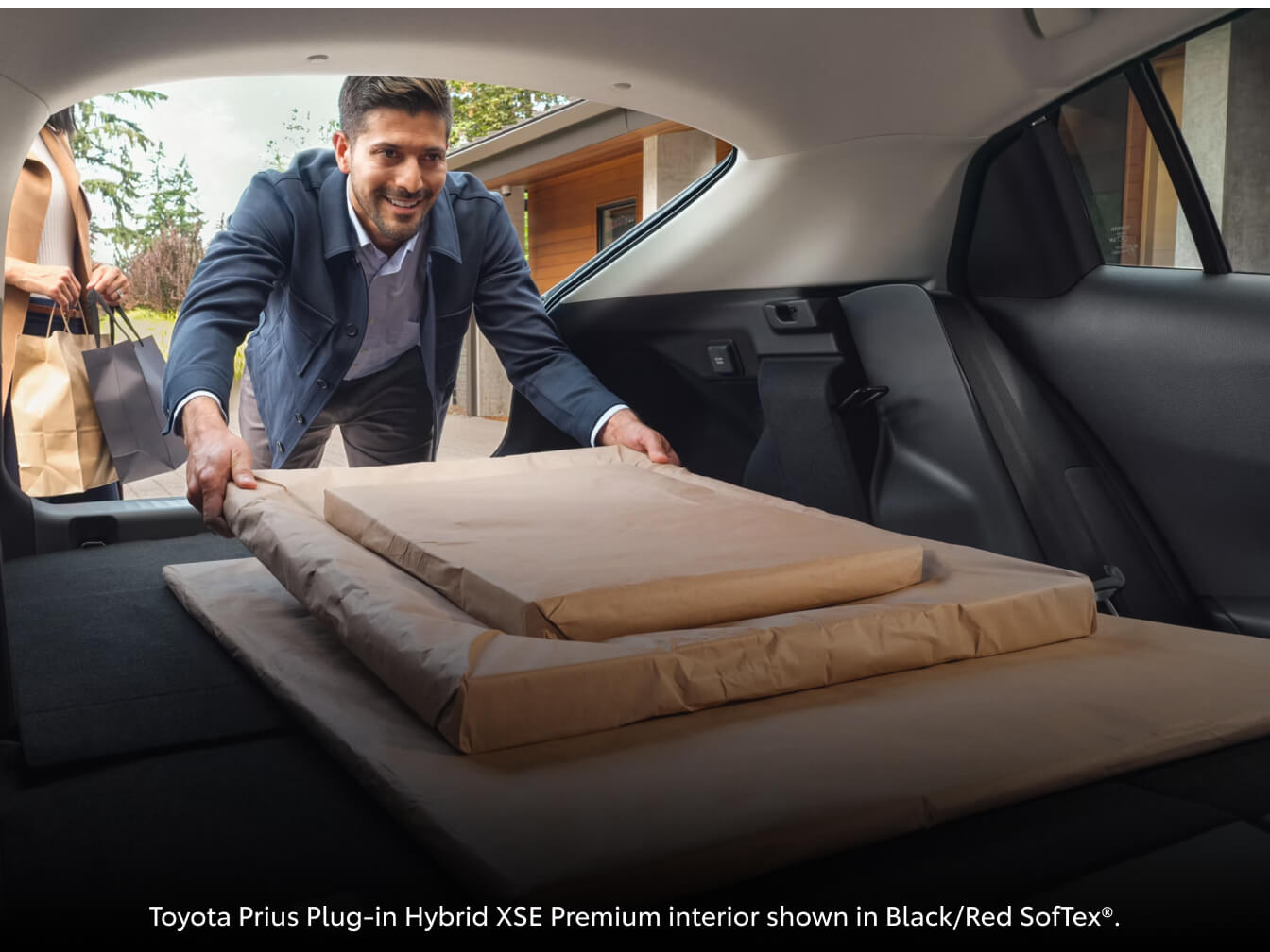 Toyota Prius Plug-in Hybrid XSE Premium cargo interior shown in Black/Red SofTexĀ®.