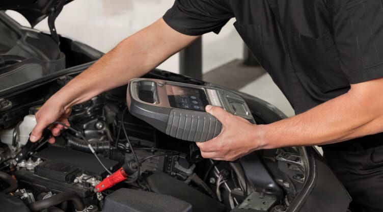  Toyota Technician working on battery
