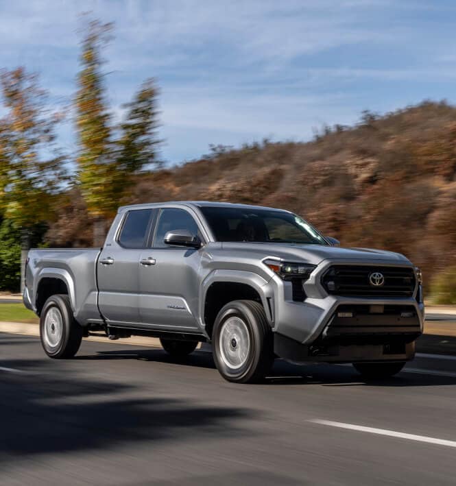 2025 Toyota Tacoma SR5 driving on an open road