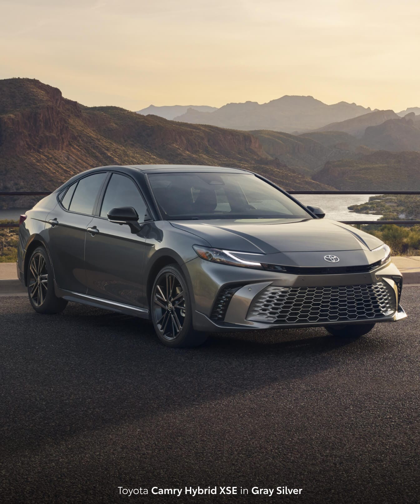 New Toyota Camry Hybrid XSE in Gray Silver parked at a scenic overlook