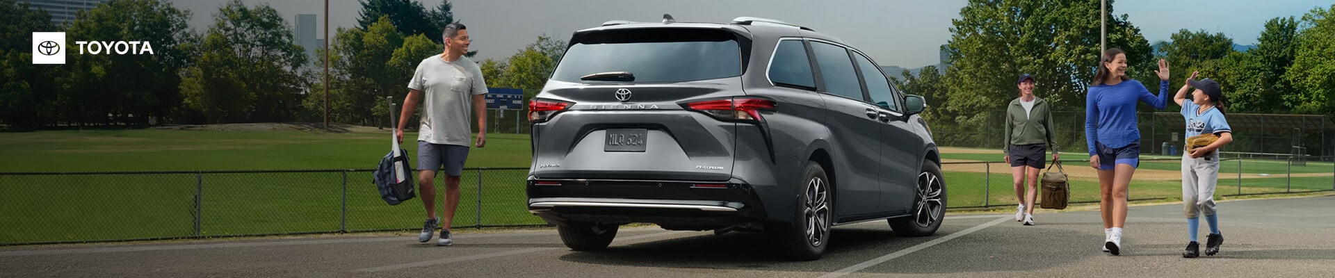 A family at the park with their silver Toyota Sienna Platinum