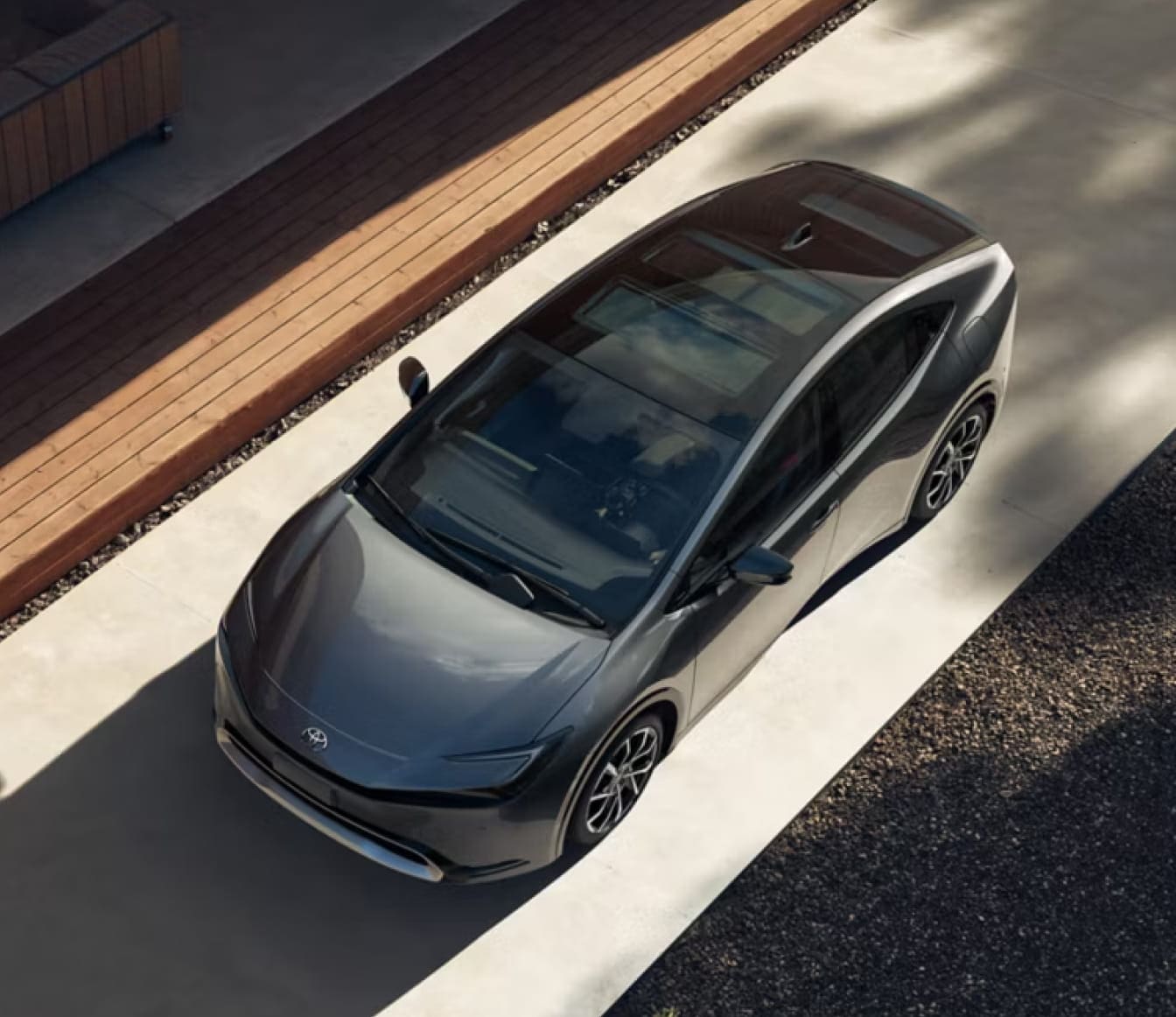 2026 Toyota Prius shown from an elevated view highlighting its sleek profile and panoramic glass roof.