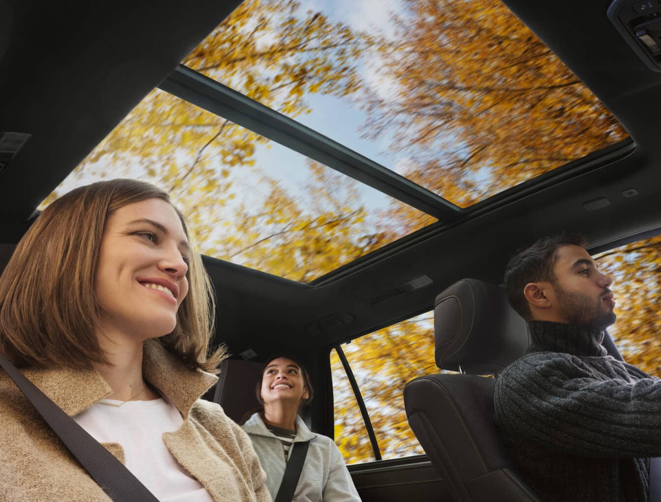 Interior shot of the moonroof inside of a 2026 Toyota Sequoia with a driver and 2 passengers