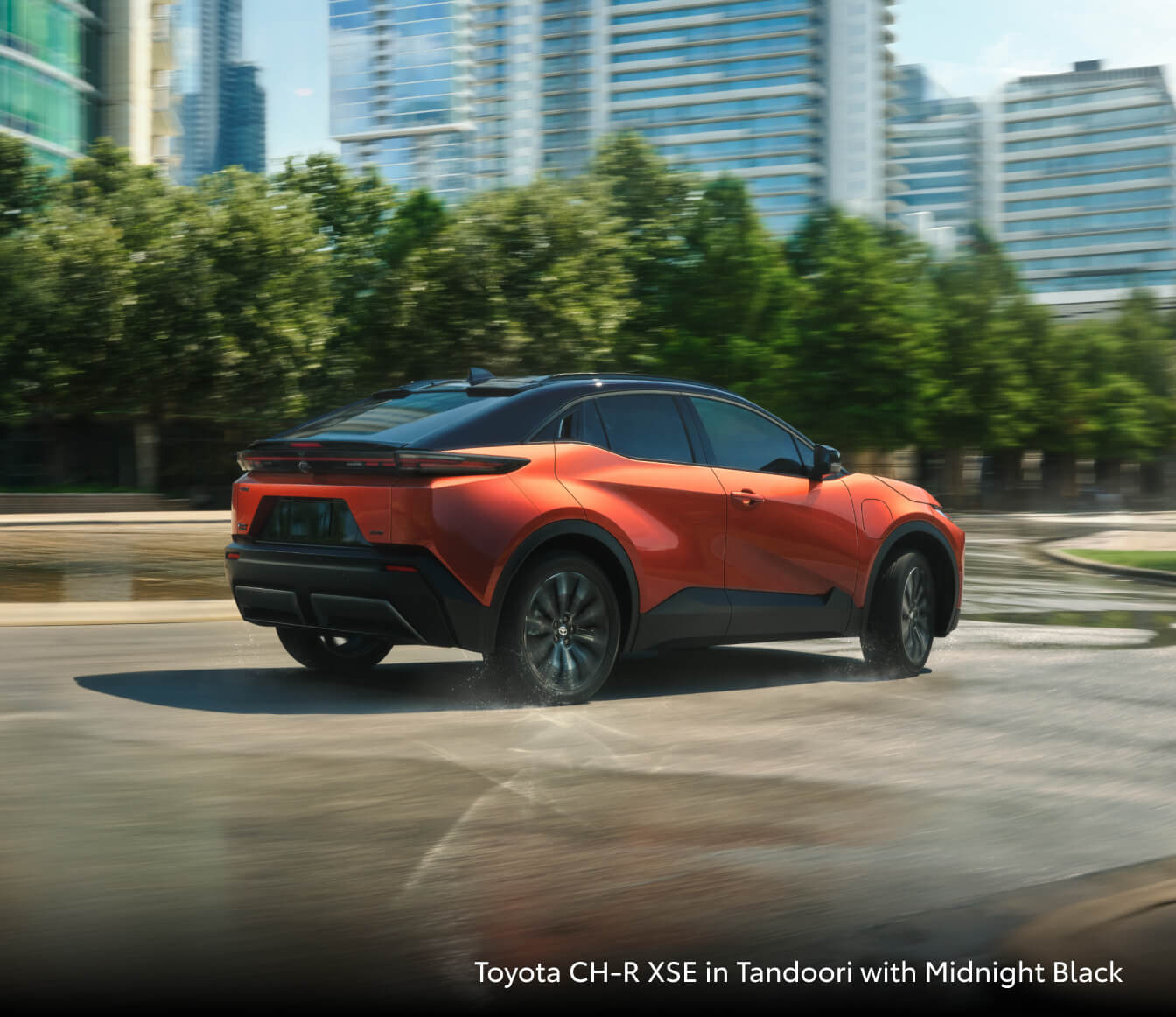 2026 Toyota CH-R XSE in Tandoori with a city backdrop