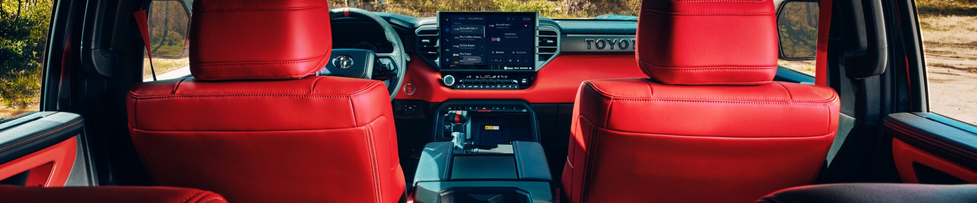 Interior shot of a 2026 Toyota Sequoia with red leather seating and accents