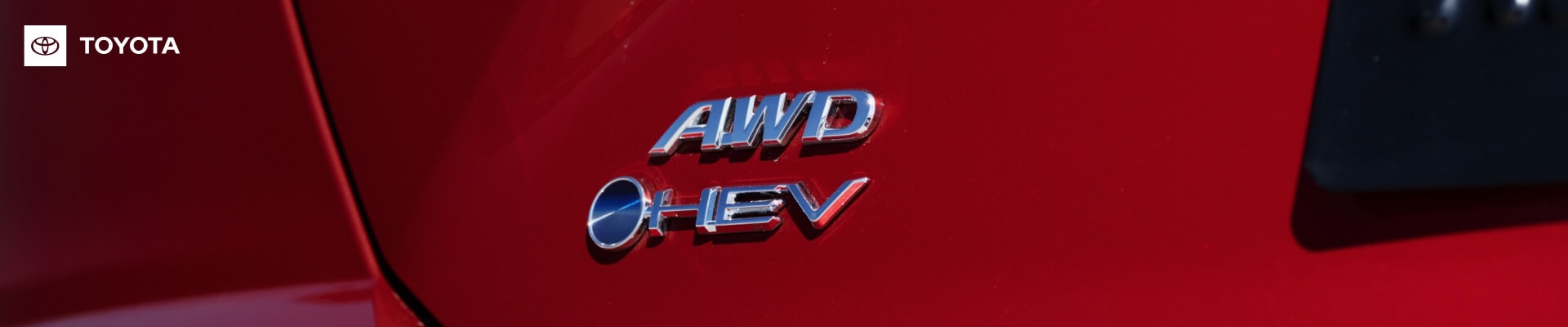 Close-up shot of the logo on a Toyota Camry AWD