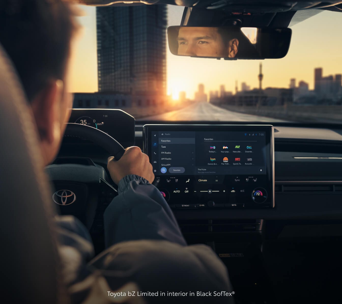 Driver's perspective of a 26 Toyota bZ Limited Black SofTex® interior showing the center touchscreen.