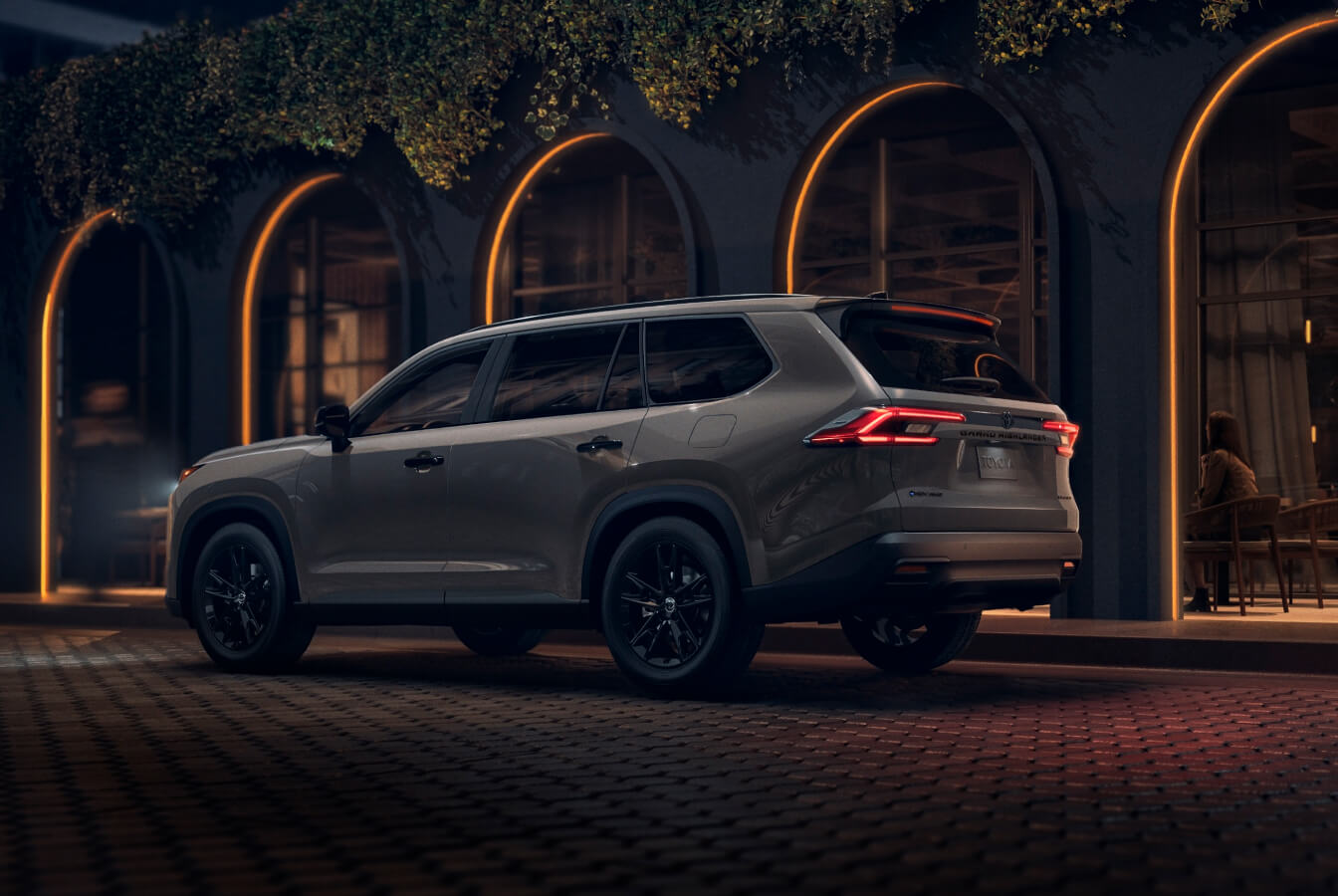 Various angle of the rear of 2026 Toyota Grand Highlander Limited in Grey.