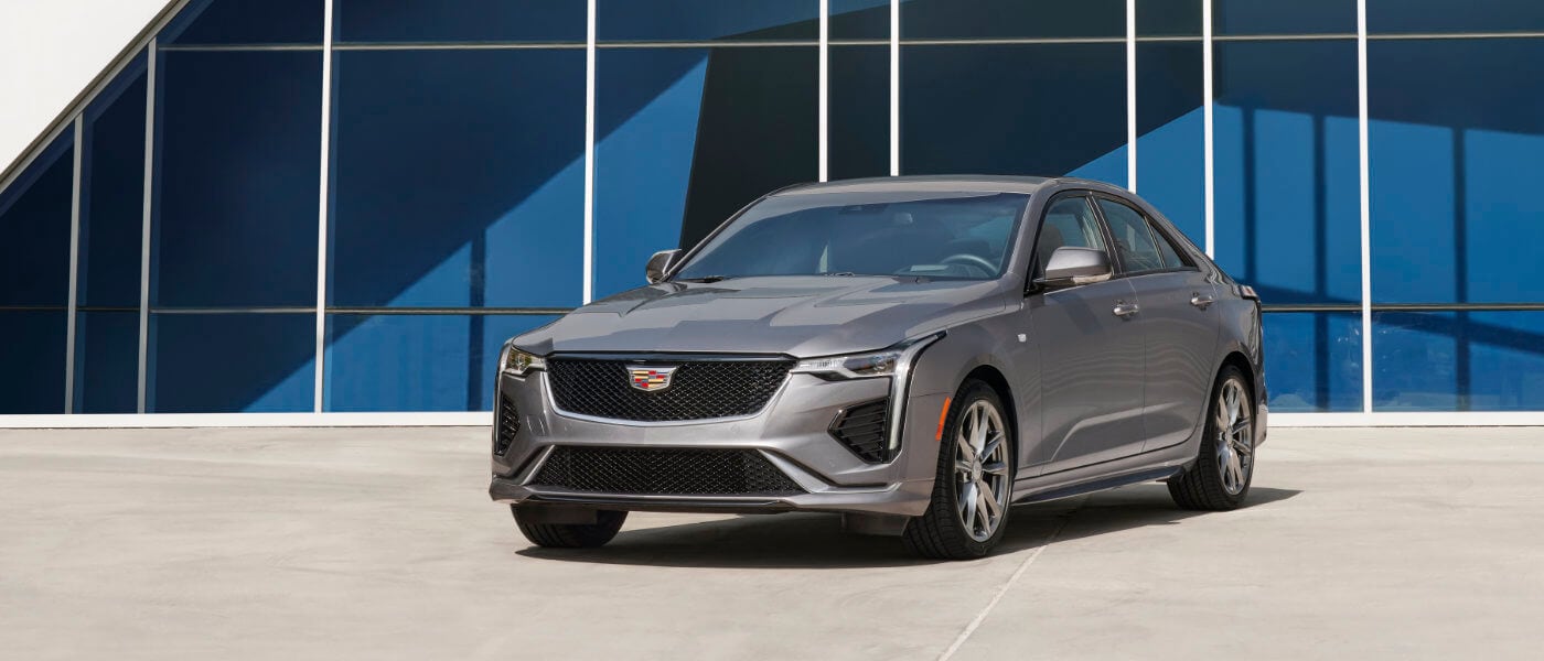 2026 Cadillac CT4 Exterior Parked In Front Of Glass Building