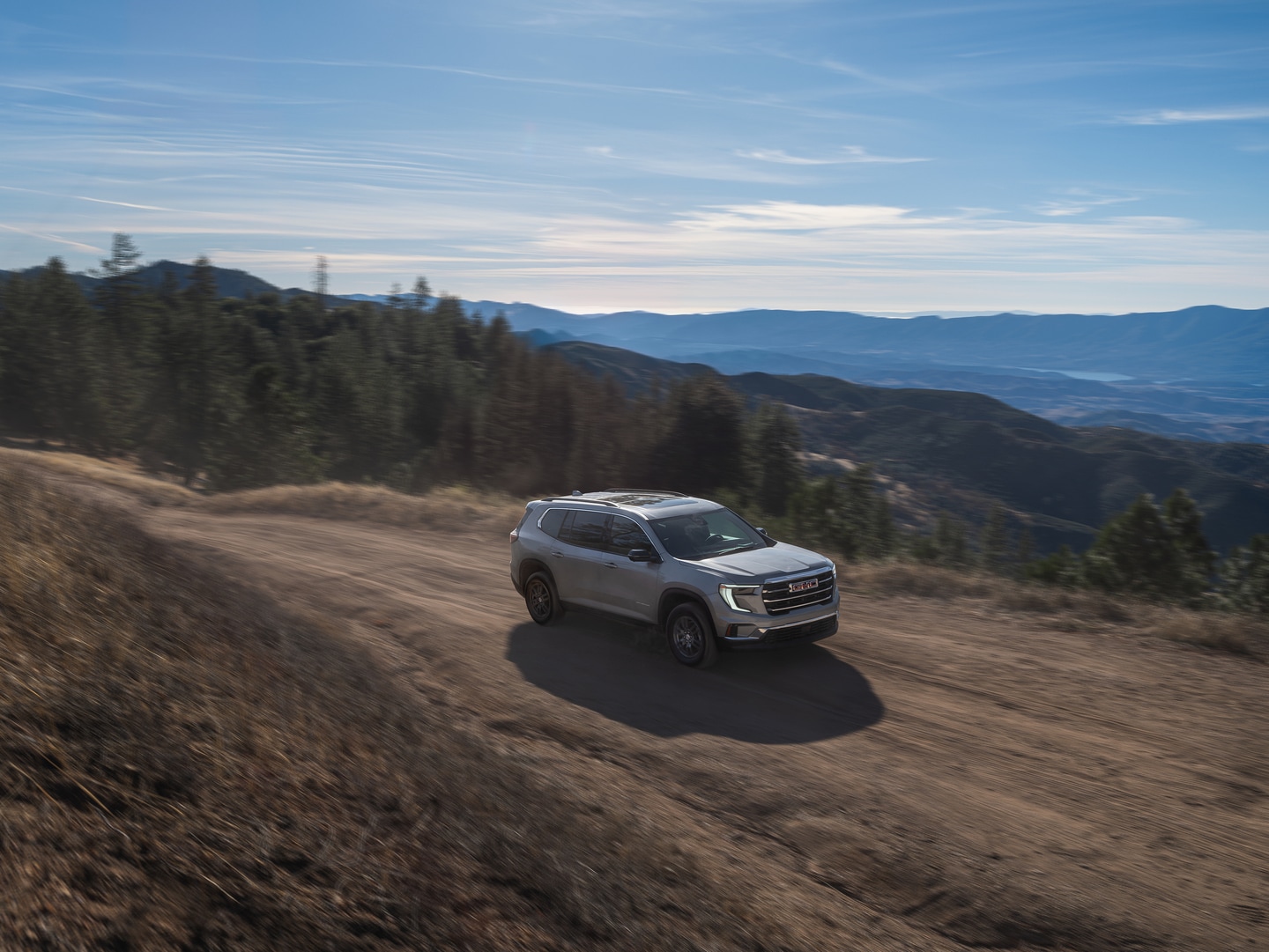 GMC Acadia on dirt road