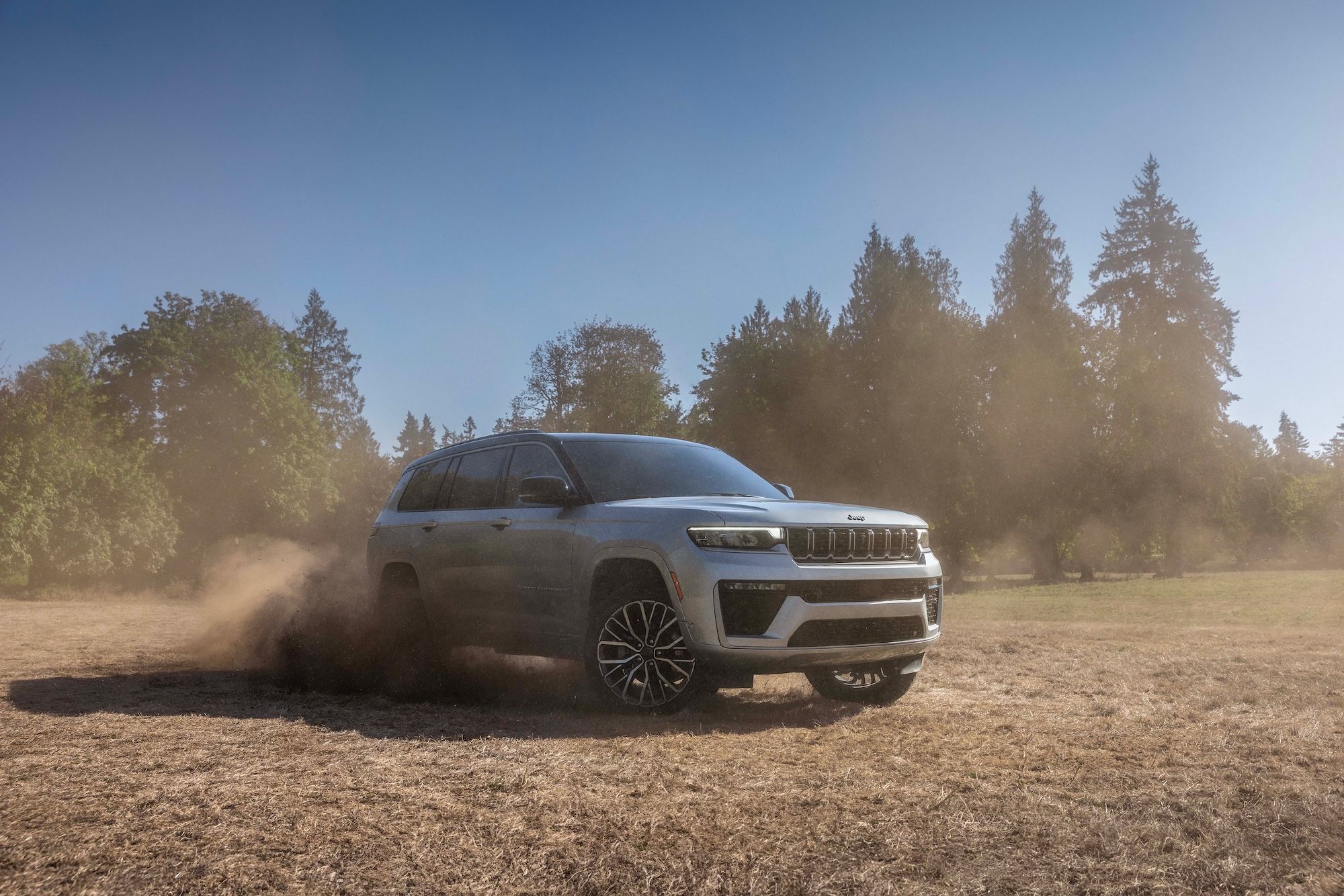  2026 Jeep Grand Cherokee driving in a field
