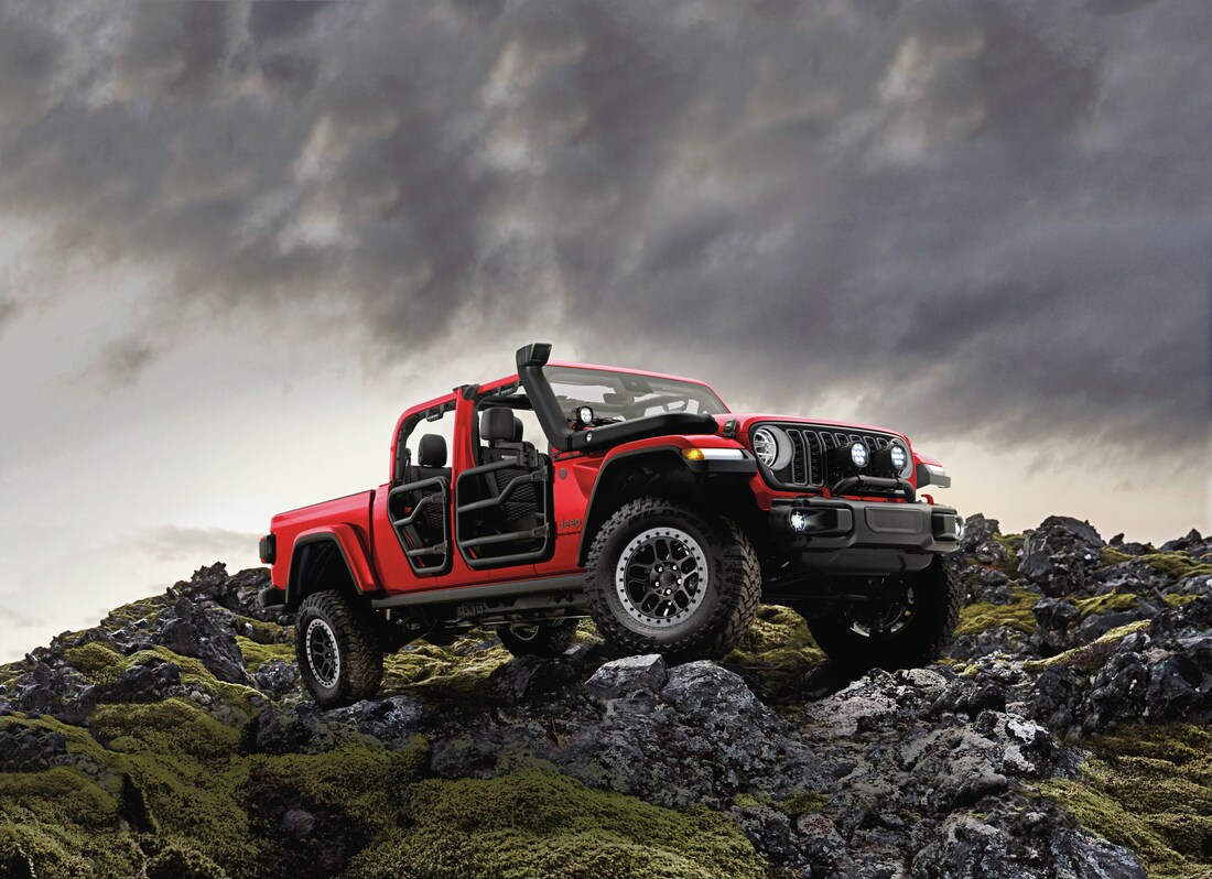  2026 Jeep Gladiator on rocky ridge with doors off