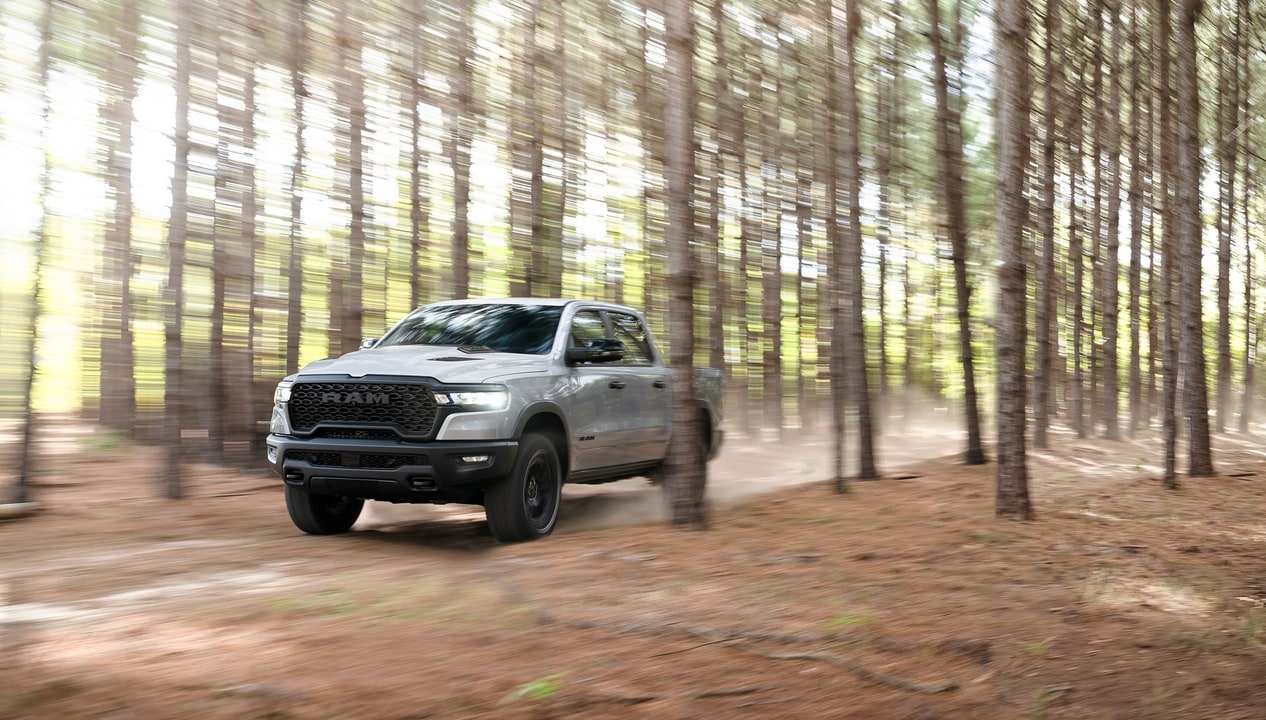 2026 Ram 1500 driving through the woods
