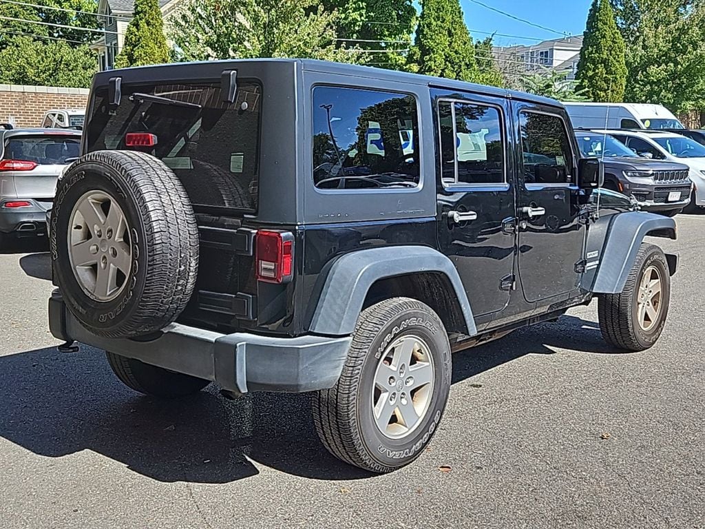 Used 2016 Jeep Wrangler Unlimited Sport S with VIN 1C4BJWDGXGL338126 for sale in Newton, MA