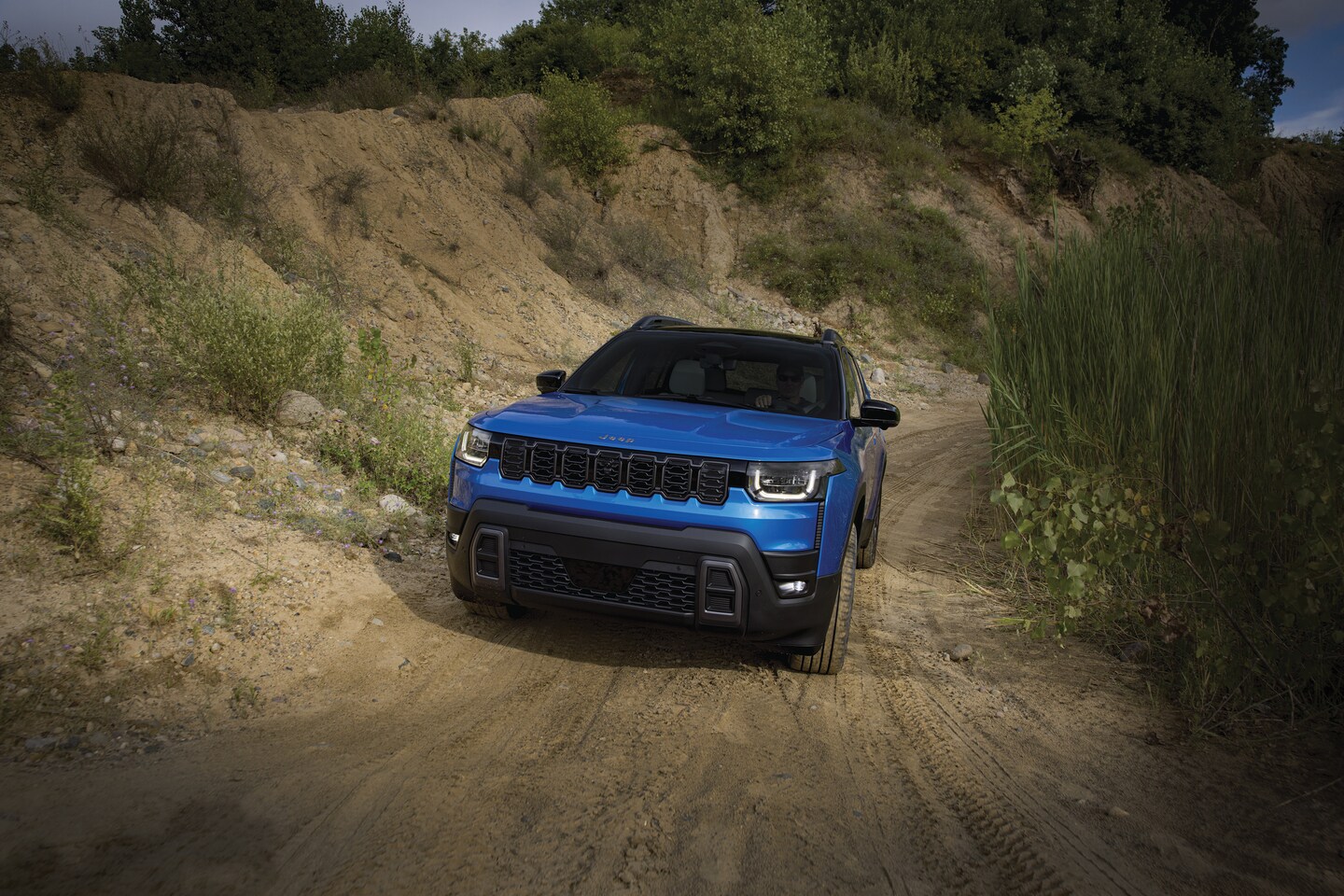 2026 Jeep Cherokee Overland driving on dirt road