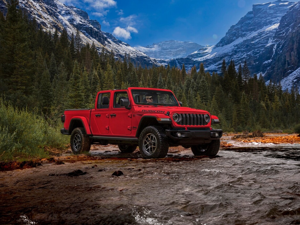  Red 2026 Jeep Gladiator parked in a stream