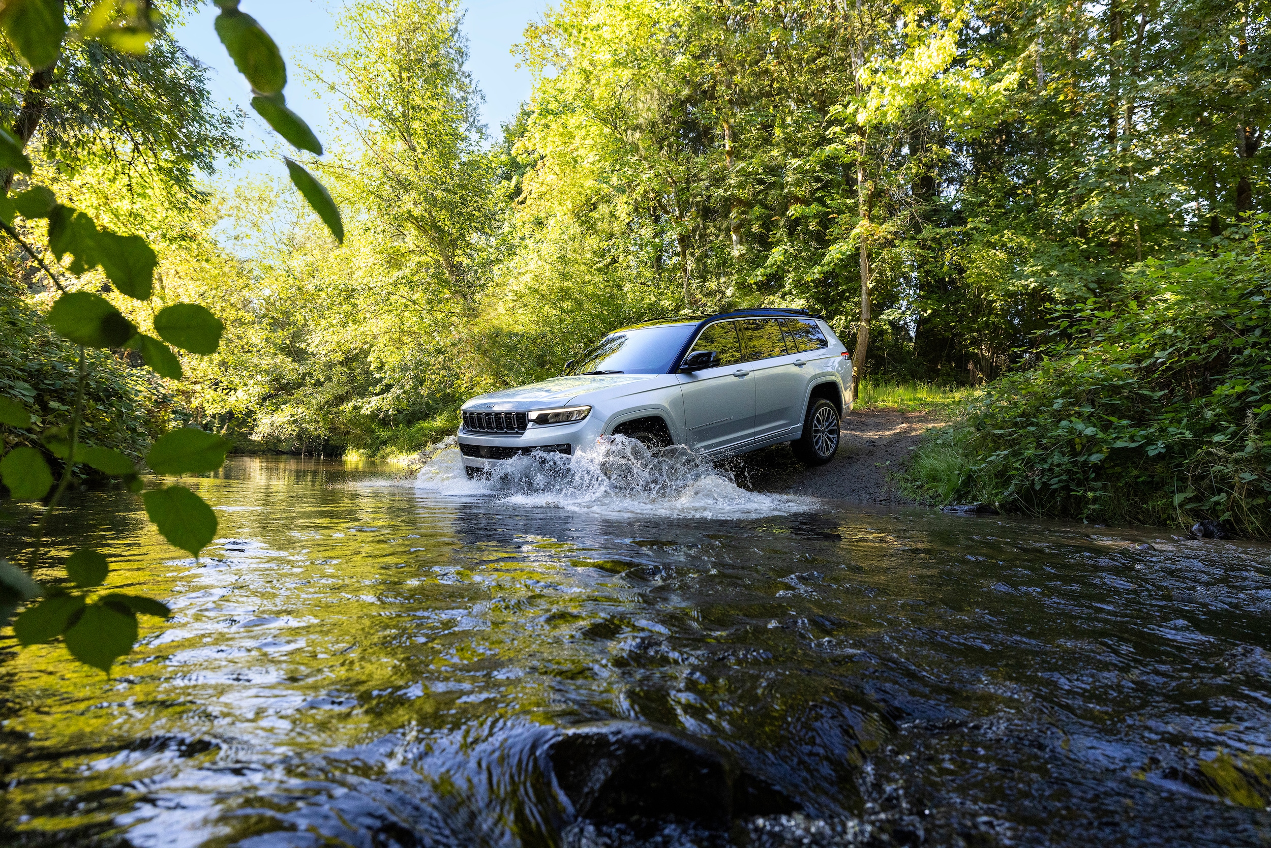  2026 Jeep Grand Cherokee L driving in a stream