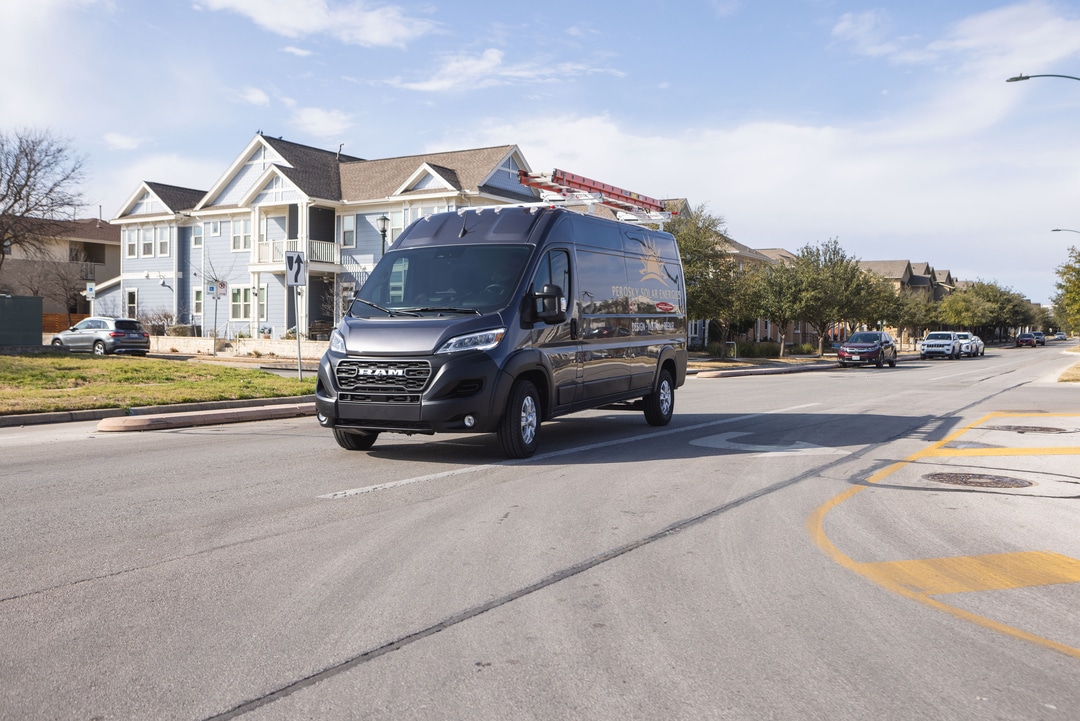  2026 Ram ProMaster driving in neighborhood