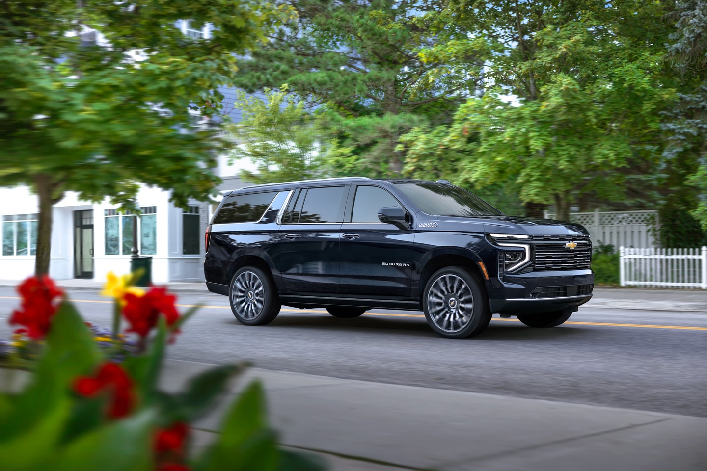 2026 Chevrolet Suburban driving in neighborhood
