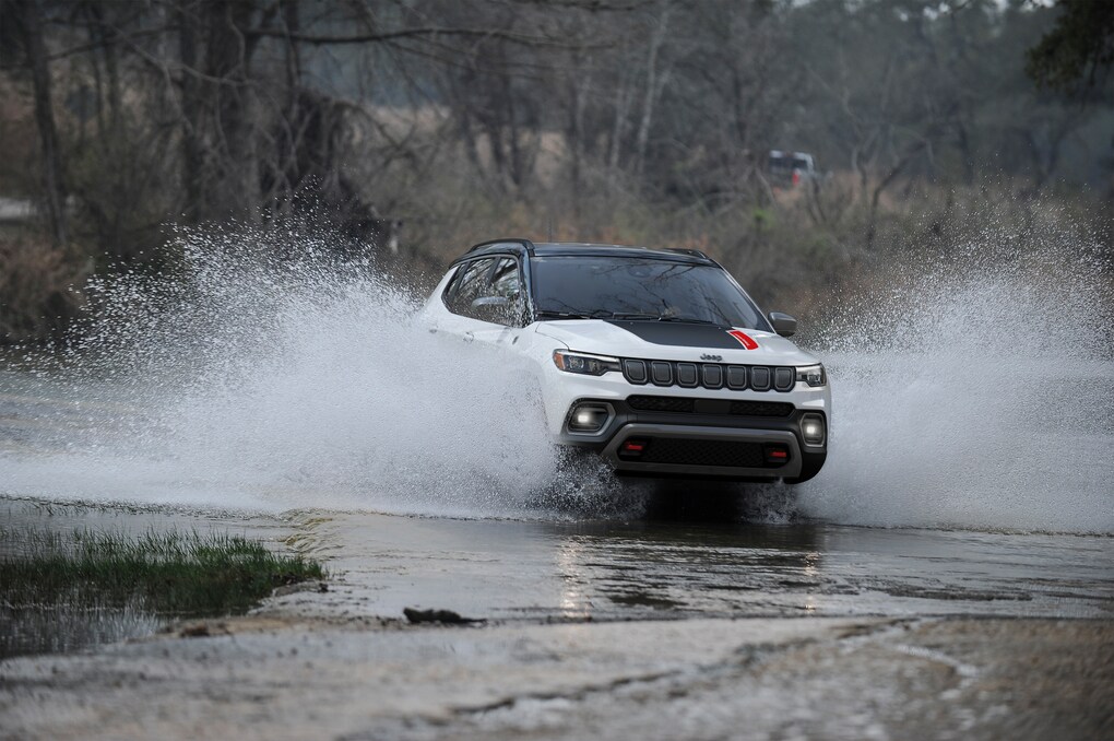 Jeep Compass driving through snow