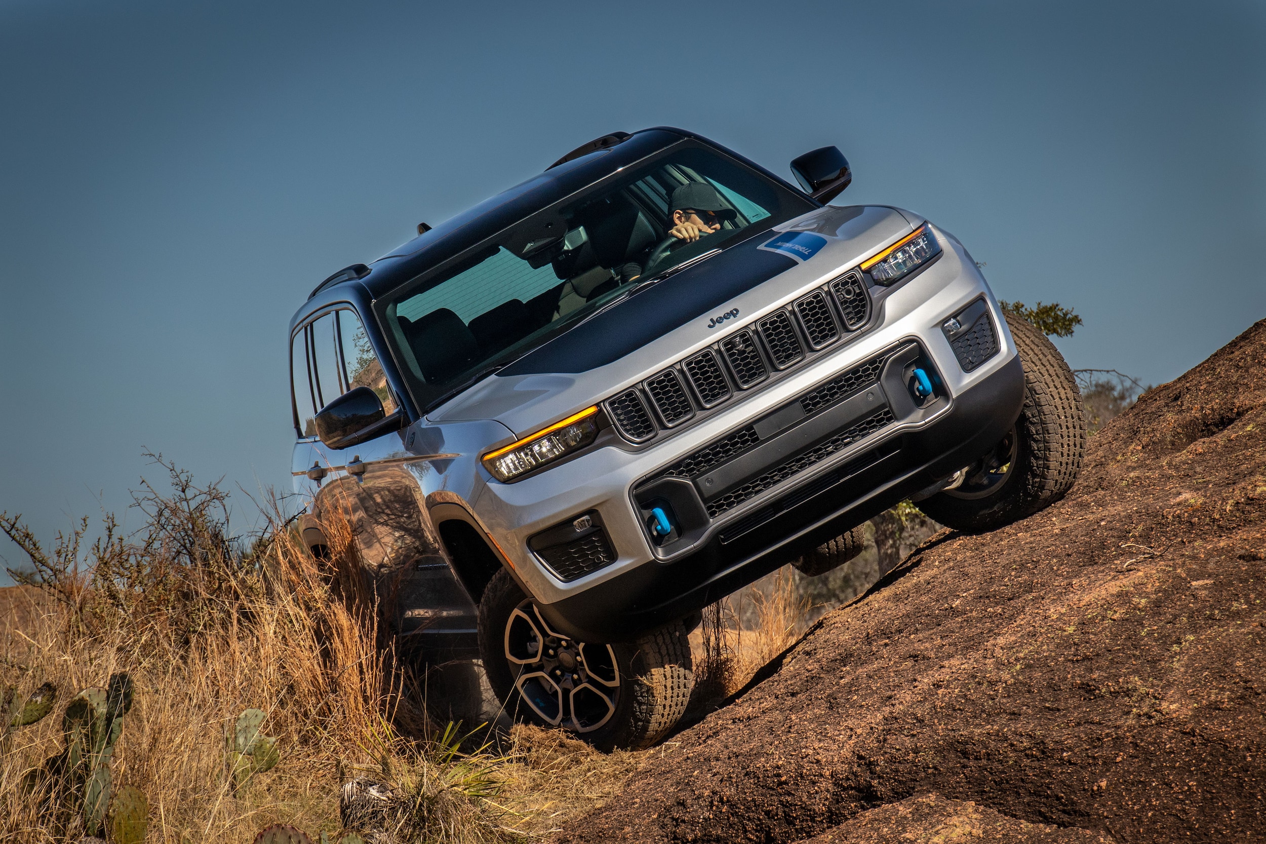 Jeep Grand Cherokee 4xe driving on dirt terrain