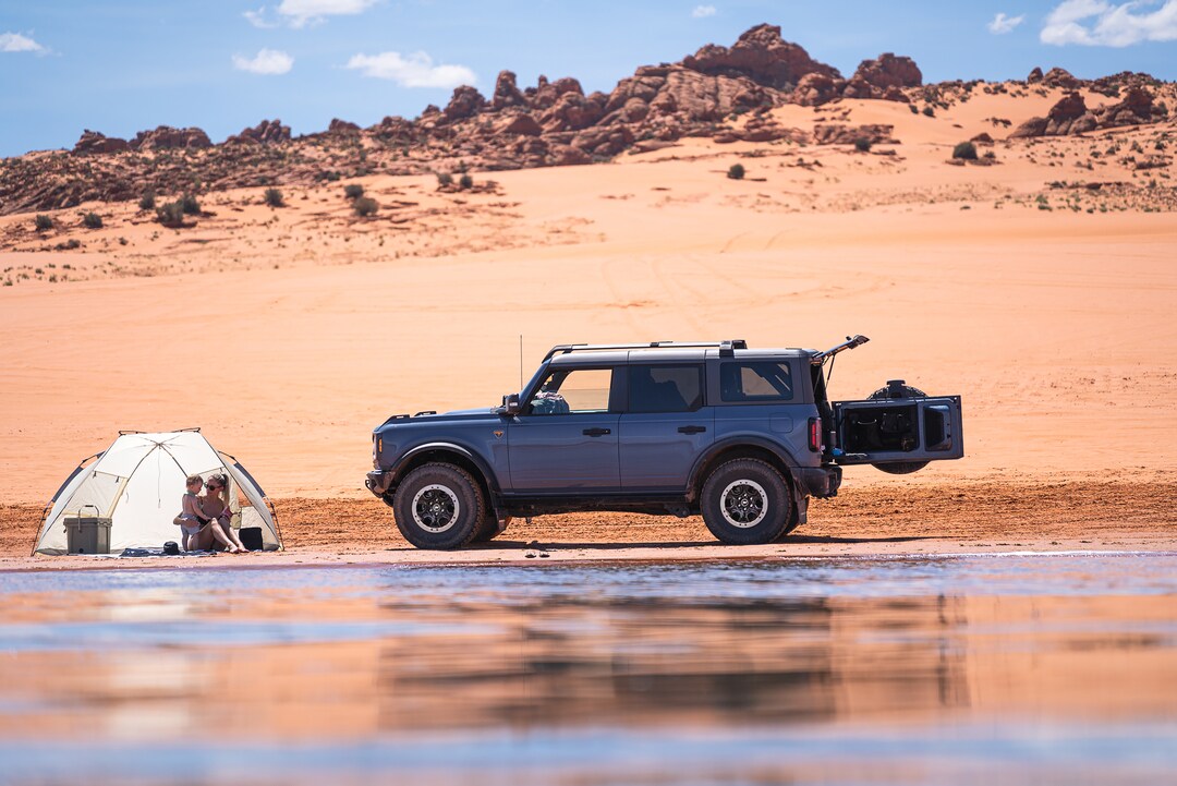  Blue Ford Bronco on rocky ridge