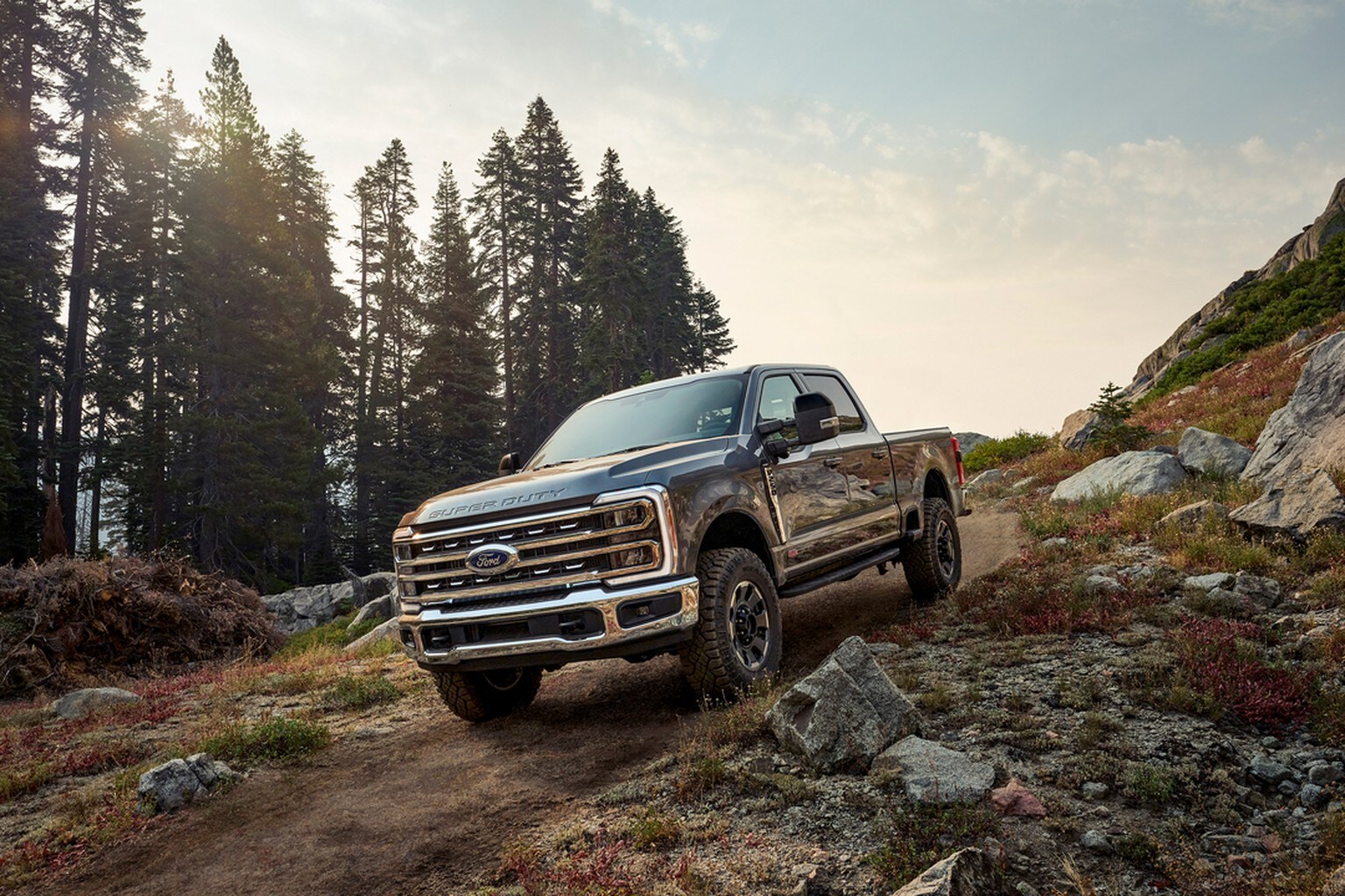 Ford F-250 driving down dirt trail