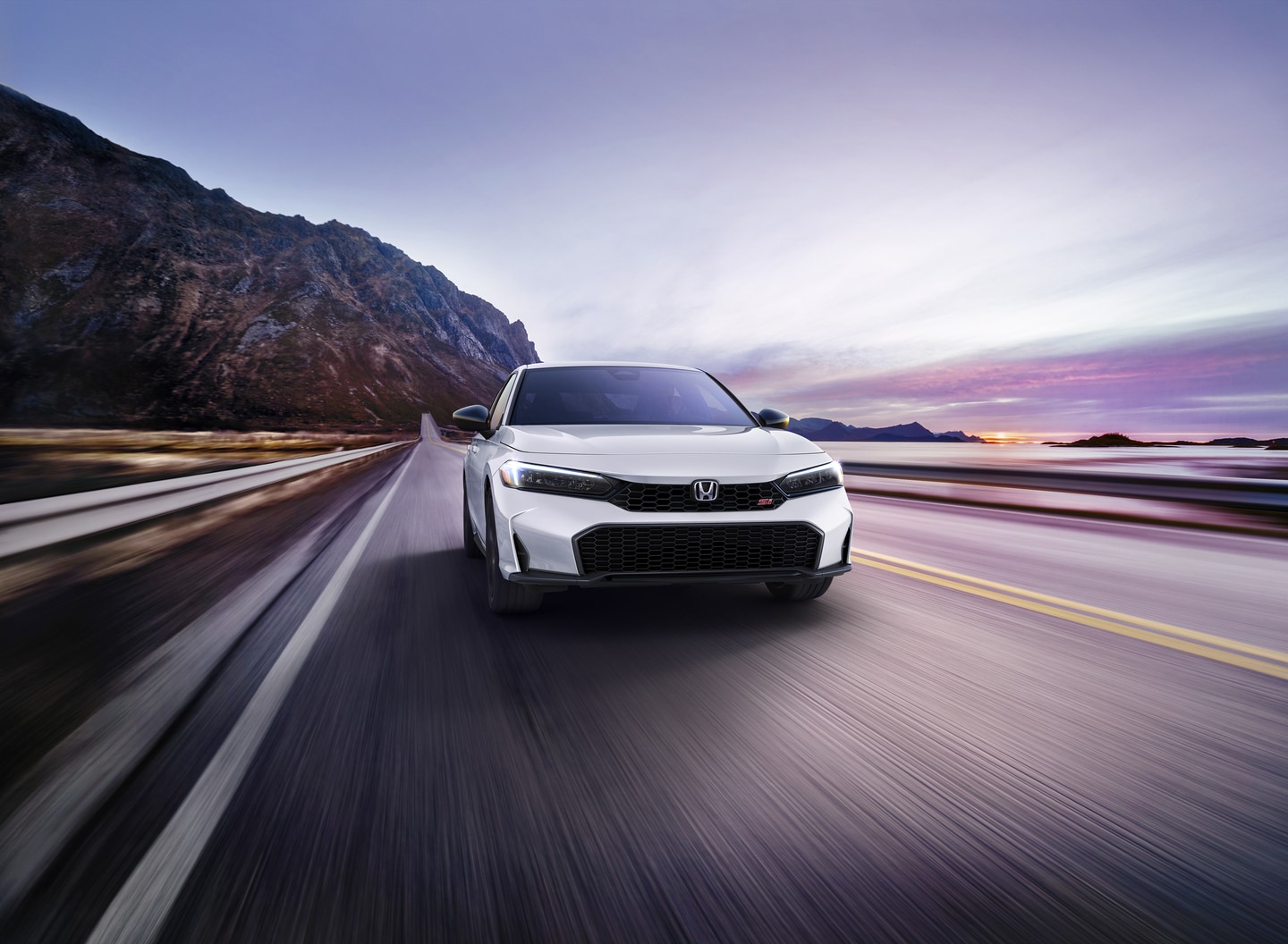 White Honda Civic Si on the highway